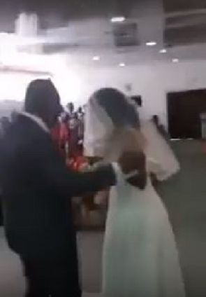 Angry 'side chick' dressed in bridal gown disrupts wedding ceremony of her lover (Video)