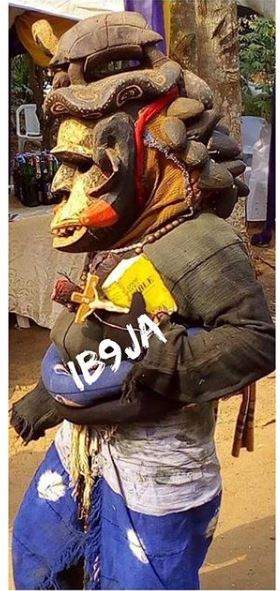 Masquerade steps out with his bible and crucifix in Agulu, Anambra State (Photos)