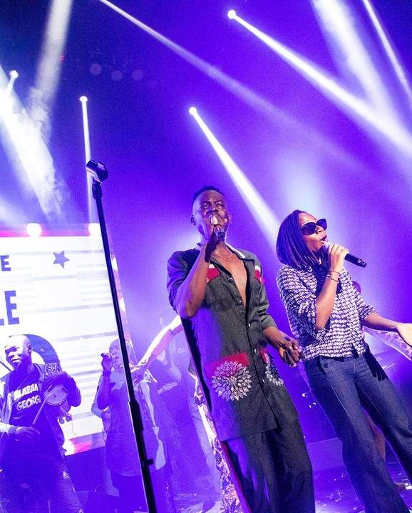 Adekunle Gold Praises Asa As He Kneels To Greet On Stage As They Perform Together