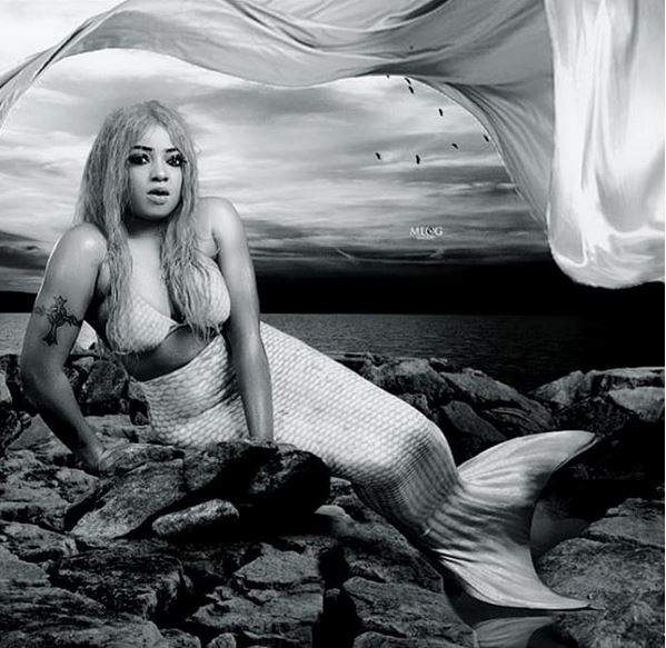 Actress Tayo Sobola poses as a mermaid as she celebrates her birthday