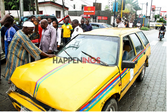 Taxi Driver Breaks Down In Tears After His Car Was Hit By A Lady In Lagos ( Photos )
