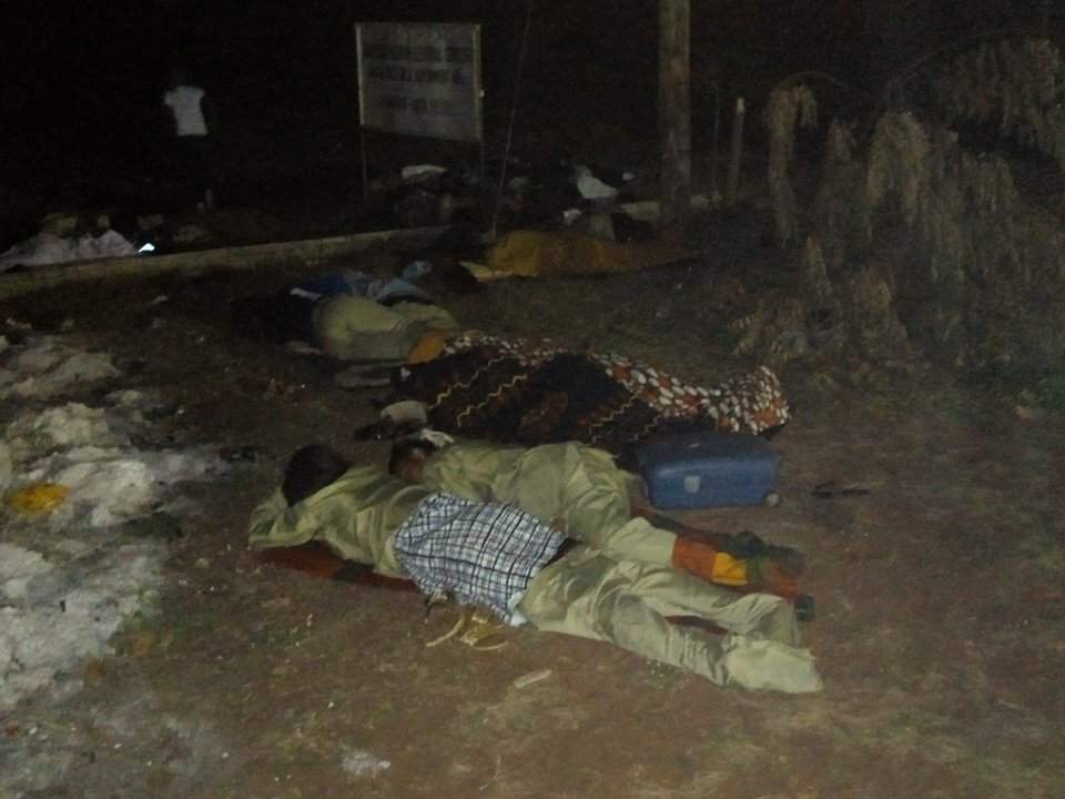 Disturbing Photos Of INEC Ad-hoc Staff, Corpers Sleeping Outside Its Premises