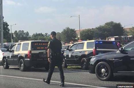 Cops seen swarming the area after a student opens fire at a school