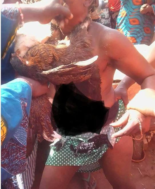 Lady Stripped Unclad After She Was Caught Stealing 8 Chickens In Benin (Photos)