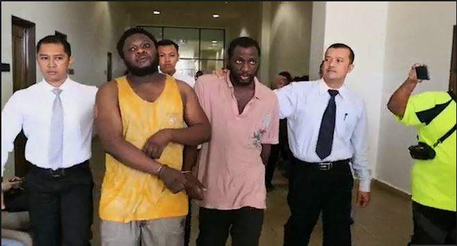 Faces Of Two Nigerian Fraudsters Arrested In Malaysia For Fraud (Photo)