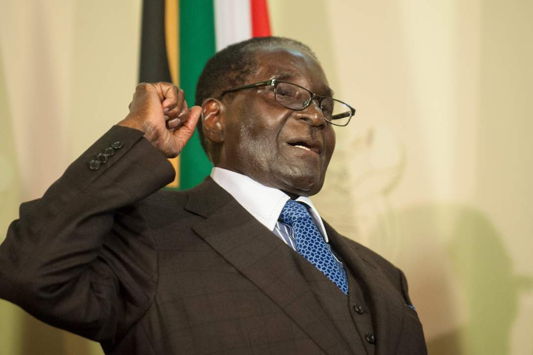 Robert Mugabe buried in steel coffin encased in concrete as family claims people are 'after his body'