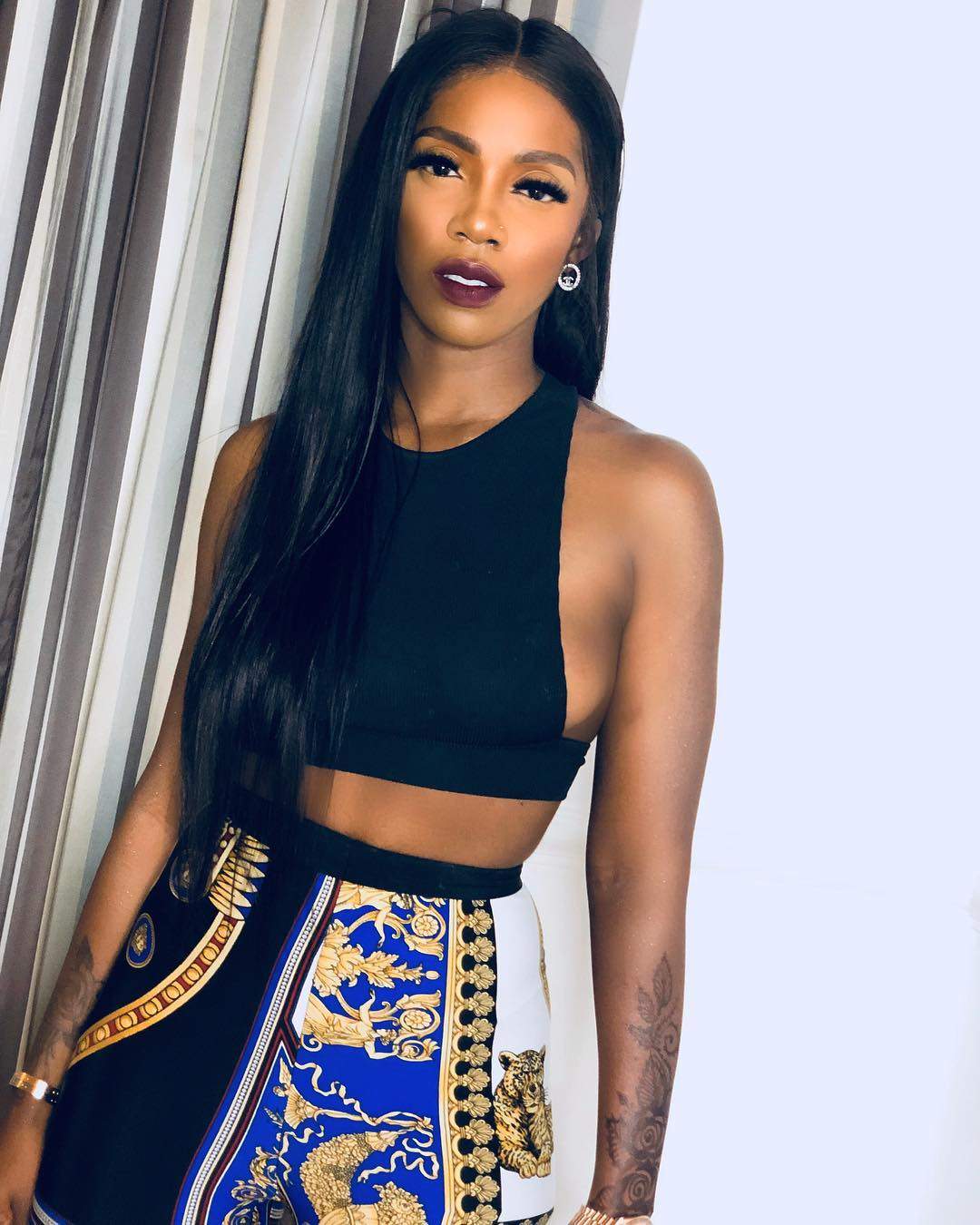 Tiwa Savage left in shock after she was pulled down on stage by an overzealous fan.