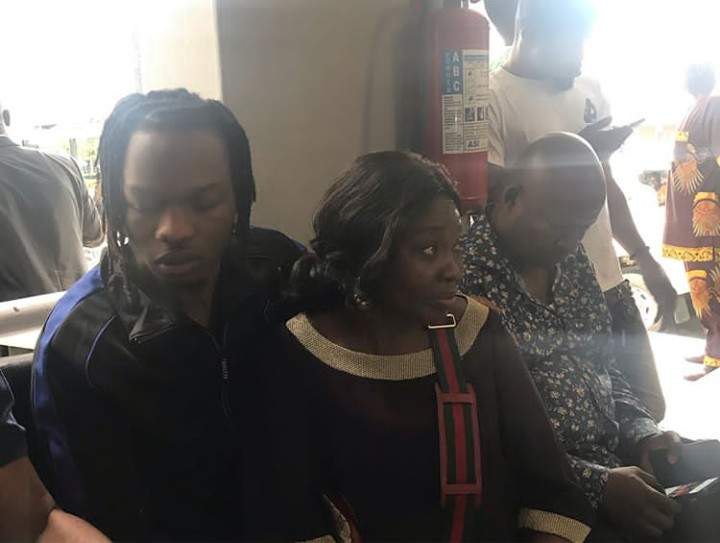 EFCC tenders evidence found on Naira Marley's laptop, iPhone in court + Photos of the Singer with his mother in court