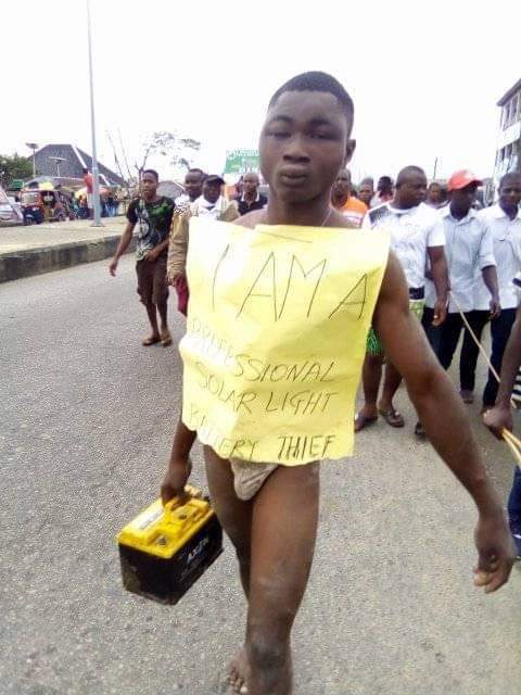 Young man gets stripped and brutally whipped for stealing solar light battery in Bayelsa community (Photos)