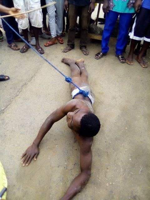 Young man gets stripped and brutally whipped for stealing solar light battery in Bayelsa community (Photos)