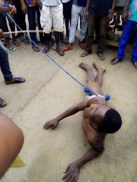 Young man gets stripped and brutally whipped for stealing solar light battery in Bayelsa community (Photos)