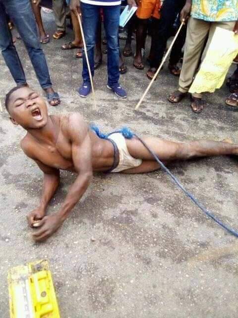 Young man gets stripped and brutally whipped for stealing solar light battery in Bayelsa community (Photos)