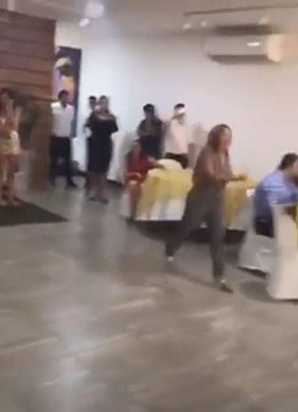 Wedding dissolves into chaos as woman crashes the event to tell groom 'I love you' before slapping the bride