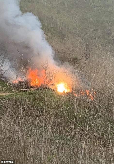 Dramatic pictures show fire engulfing Kobe Bryant's helicopter after it crashed killing the NBA star, his daughter and seven others