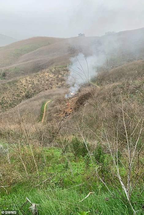 Dramatic pictures show fire engulfing Kobe Bryant's helicopter after it crashed killing the NBA star, his daughter and seven others