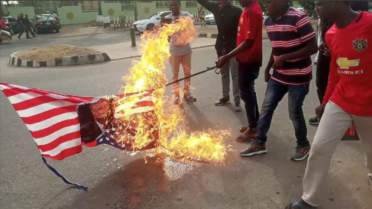 Iranian General's killing: Shi'ites protest in Abuja; burn US flag (Photos)