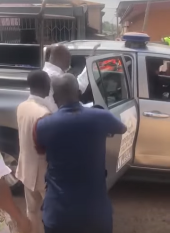 Moment police storm packed church to arrest the pastor for conducting service despite government order banning public gatherings (video)