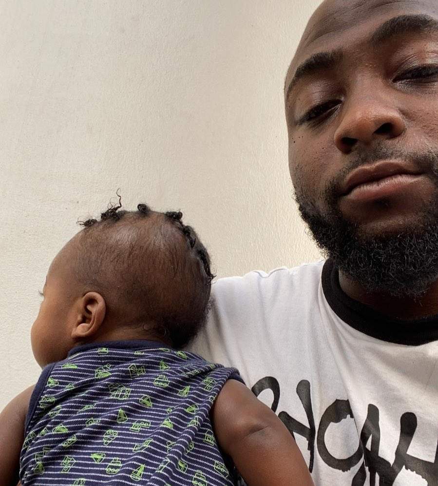 Davido looks exhausted as he takes care of his son while Chioma is being treated for Covid-19; says 'mothers are trying'