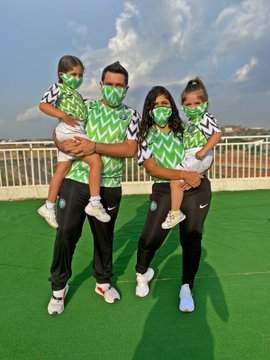 White Nigerian shares an adorable family photo with Nigeria's jersey & face mask