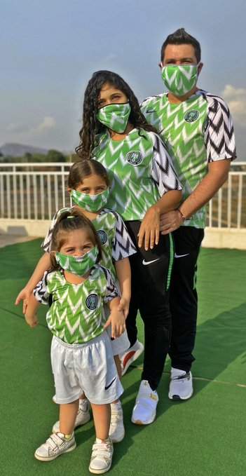 White Nigerian shares an adorable family photo with Nigeria's jersey & face mask