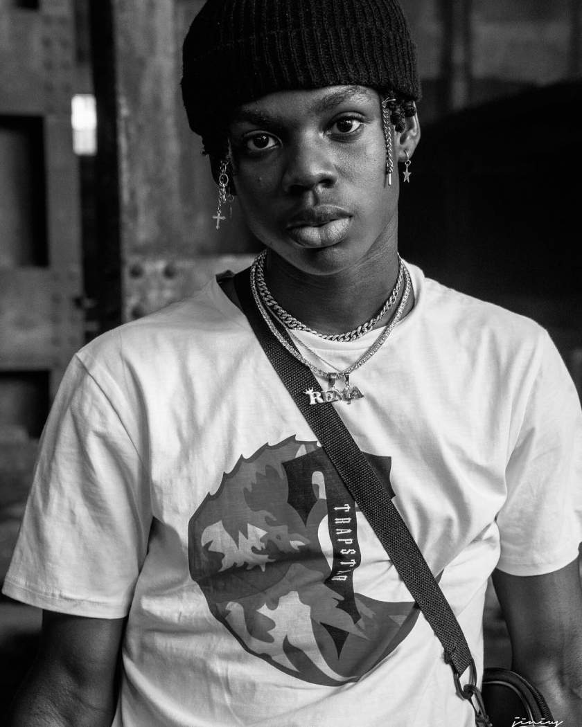 Fans react to photo of mystery lady chilling with Rema in his bedroom