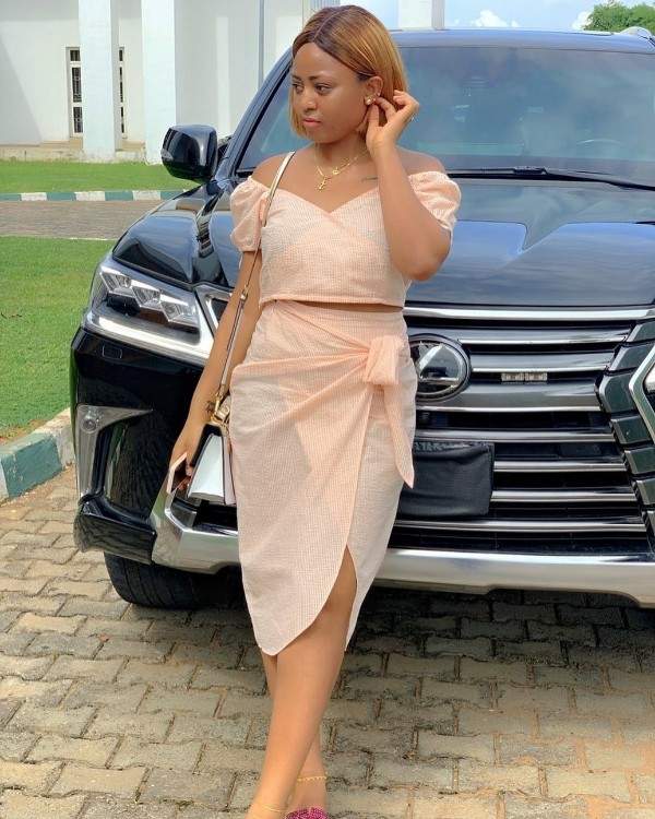Check Out 10 Stunning Photos Of Regina Daniels Posing With Supercars