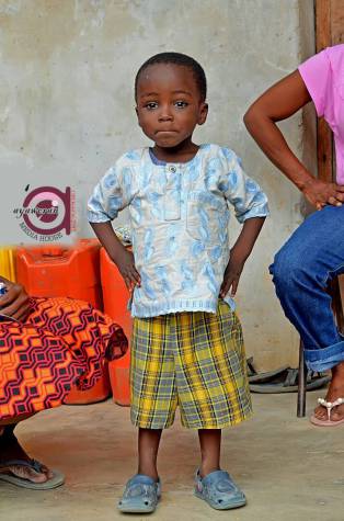 Cute Little Boy Who Photobombed A Wedding Photo That Went Viral Has Been Found, Set To Be Sponsored To University