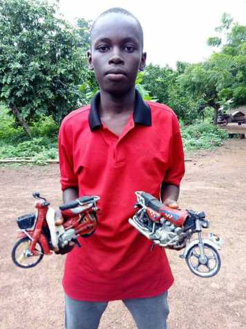 Nigerian Man Posts Photos Of The Talented Benue Boy He Met Who Creates Stuff From Scrap Materials