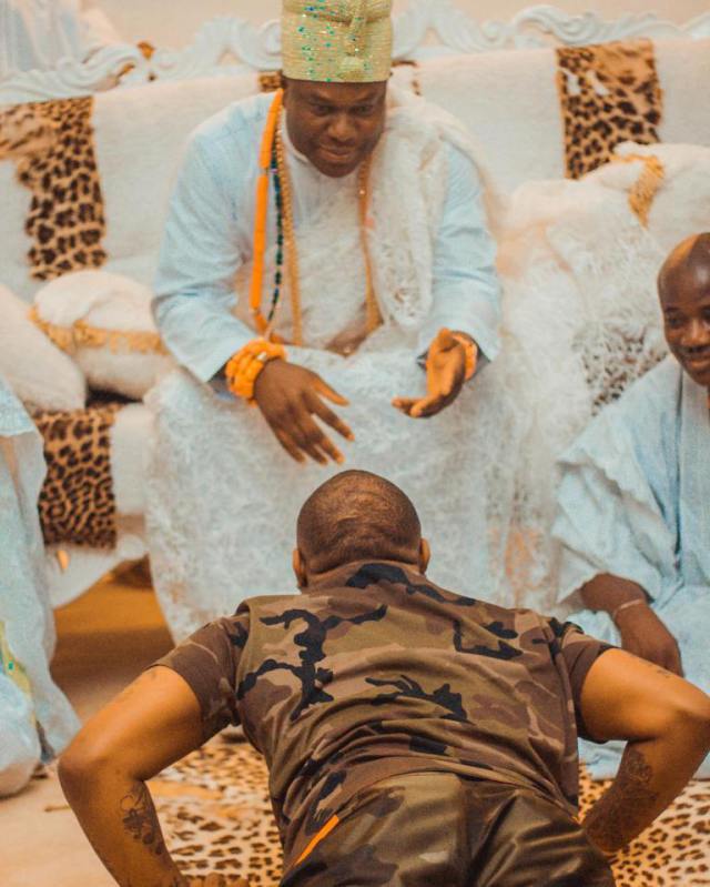 Davido laying down to greet the Ooni of Ife