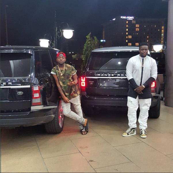 Davido and brother, Adewale pose with their Range Rover SUVs