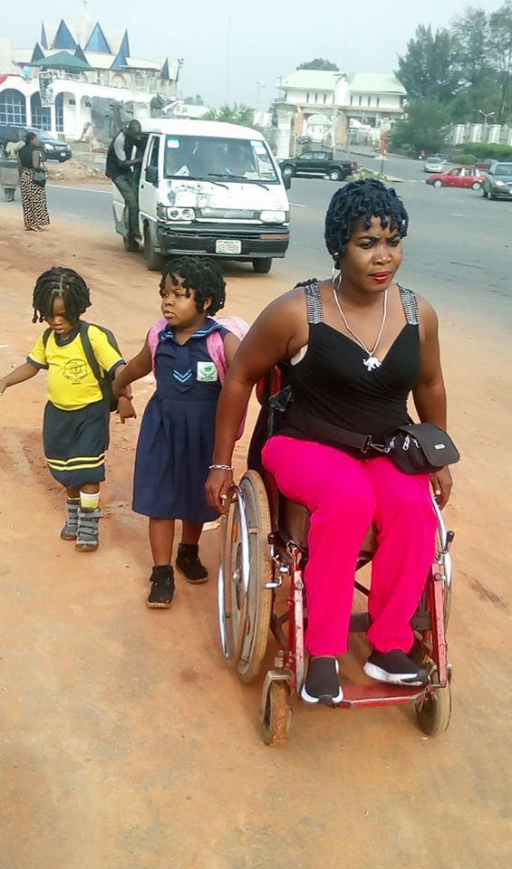 Emotional Photo Of Physically-Challenged Nigerian Mother Taking Her 3 Kids To School