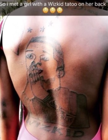 Face of die-hard Wizkid's fan who tattooed his face on her back revealed! - Wizkid is looking for her. (photos + video)