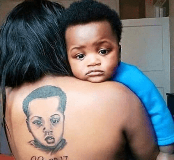 Mother tattoos her son's face on her back