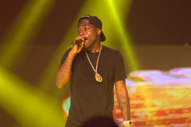 Female fans grab Davido's manhood while he performing on stage (video)