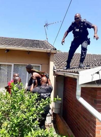 Man high on drugs begs police to shoot him after climbing roof