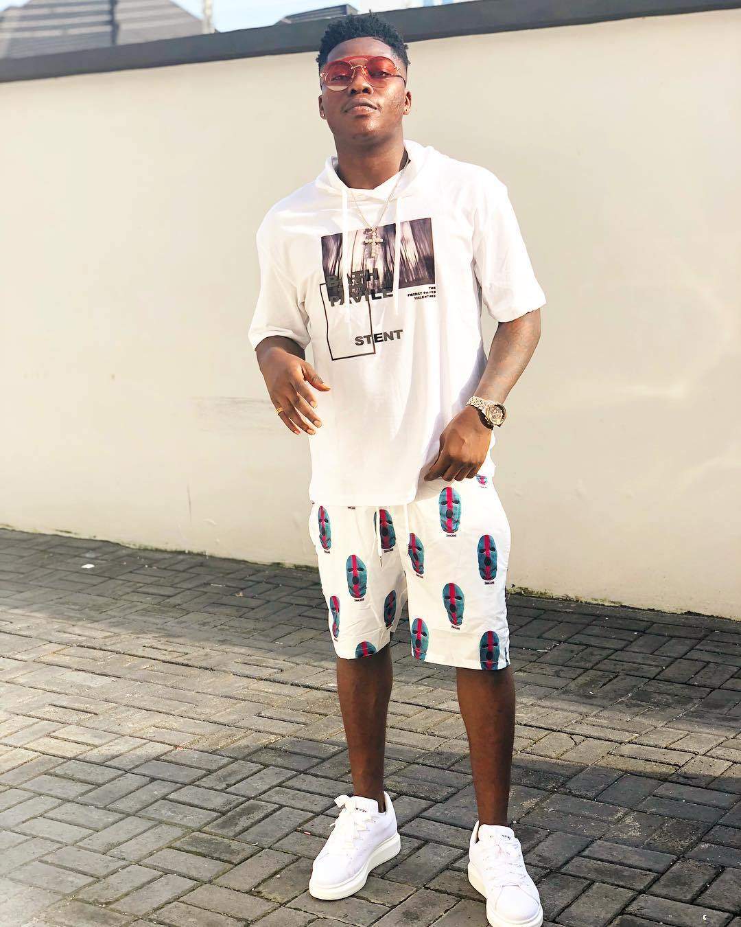 Reekado Banks gets 25 cakes from his brother to celebrate his 25th birthday