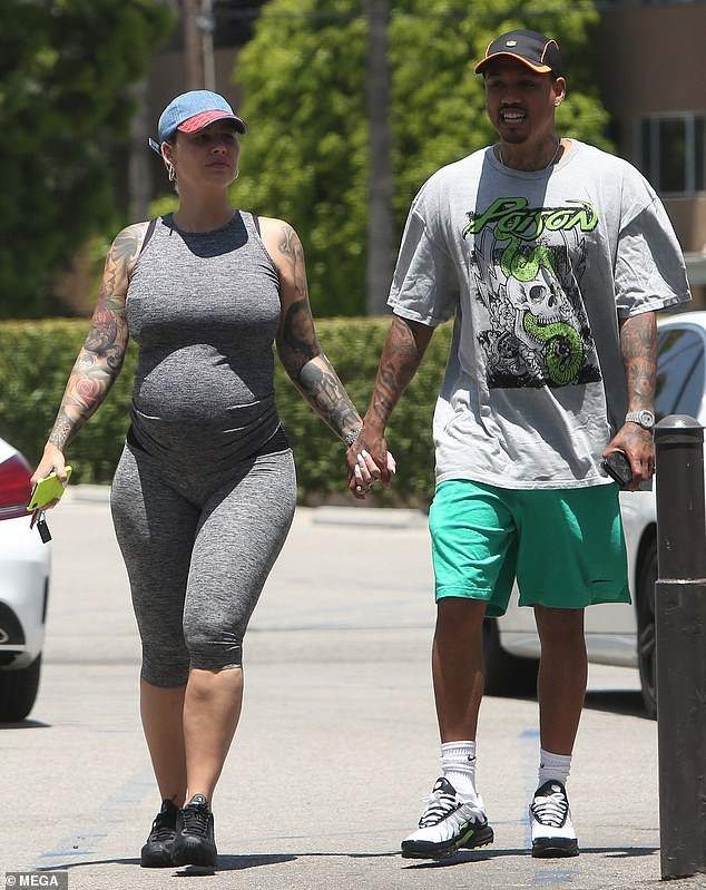 Amber Rose flaunts growing baby bump during date with boyfriend, Alexander 'A.E.' Edwards in LA (Photos)