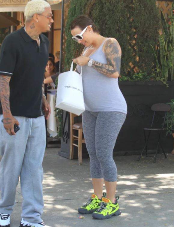 Amber Rose dumps her signature blonde look as she starts growing her hair (Photos)