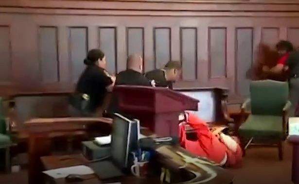 Brothers jailed after they attacked their mother's killer in dramatic court room brawl (Photos)
