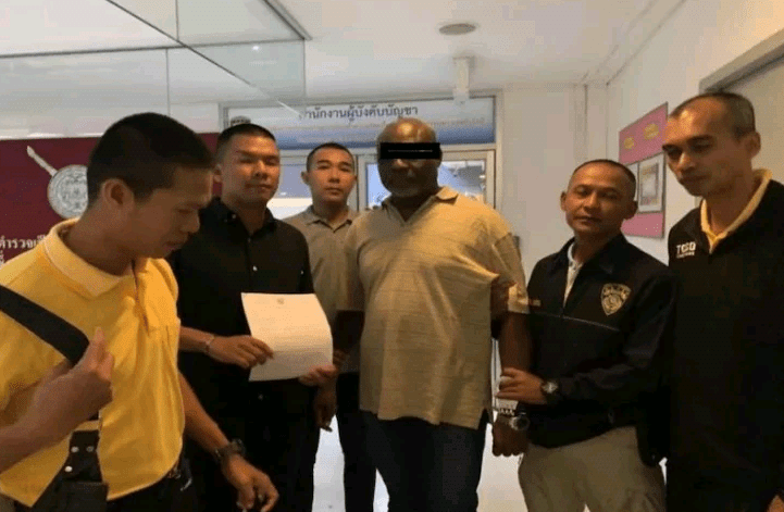 Wanted Nigerian fraudster arrested in Thailand as he arrives Immigration office to extend his visa (Photos)