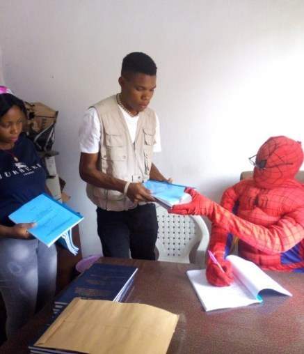 'Spider Man Lecturer' Excites His Final Year Students As He Signs Their School Projects