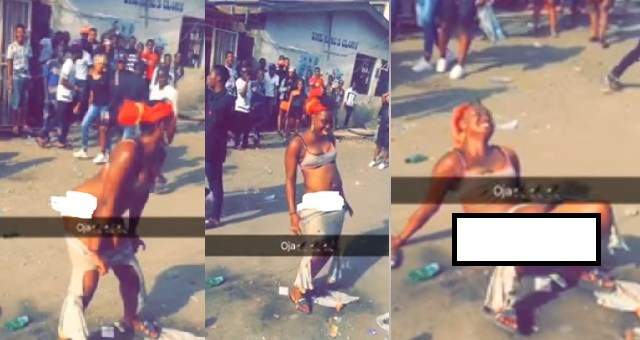 Lady strips off in the middle of a road in Lagos (photos)