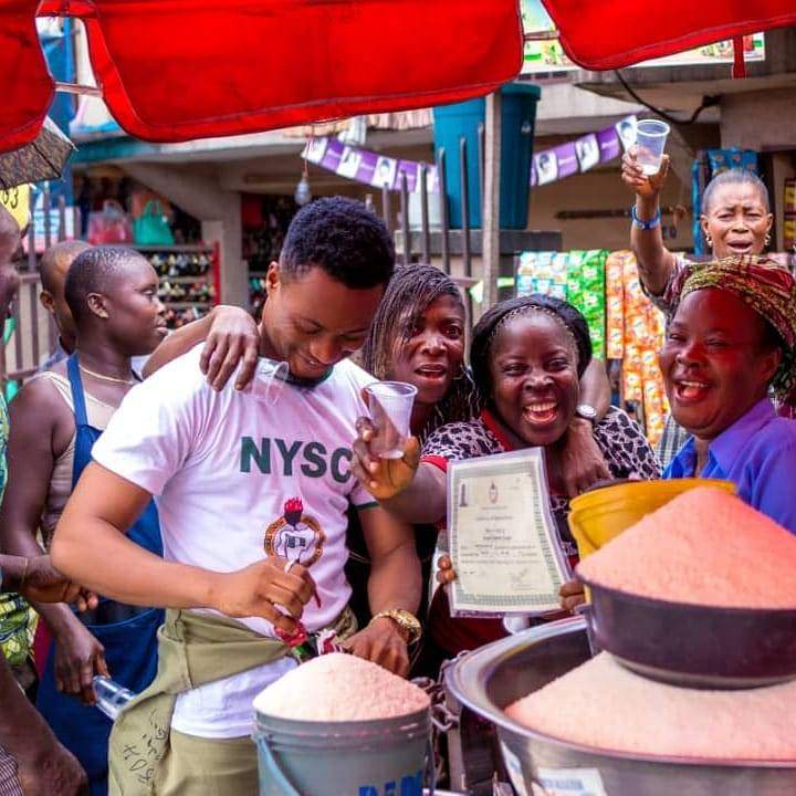 Graduate celebrates with his mom at the market after passing out of NYSC