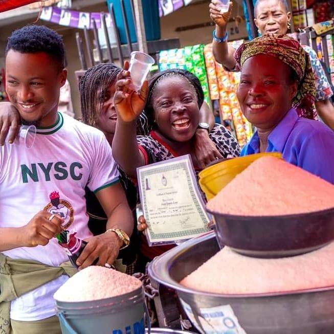 Graduate celebrates with his mom at the market after passing out of NYSC