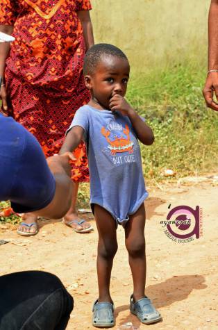 Cute Little Boy Who Photobombed A Wedding Photo That Went Viral Has Been Found, Set To Be Sponsored To University