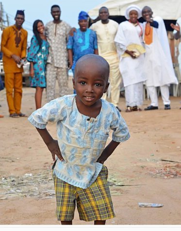 Cute Little Boy Who Photobombed A Wedding Photo That Went Viral Has Been Found, Set To Be Sponsored To University