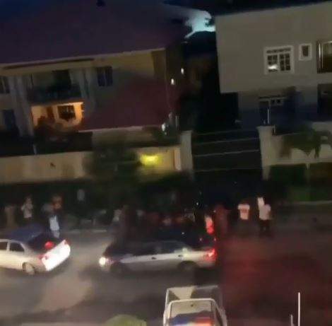 Fans Queue in front of Davido's House to Collect Money