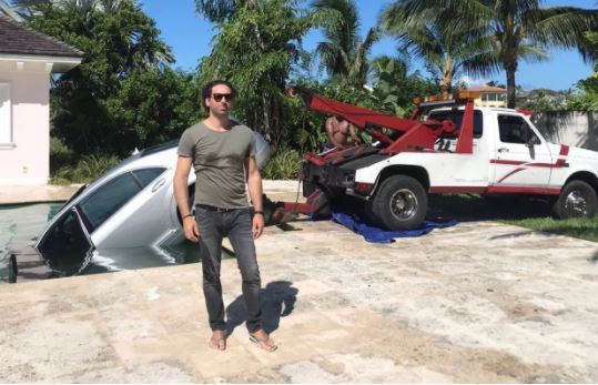 Banker's Dumped Girlfriend Drives His Mercedes Car Into A Swimming Pool As Revenge. (Photos)