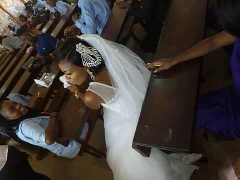 Exclusive: 300 Level student spotted writing her Exams with her bridesmaid on her wedding day in Benue (photos)