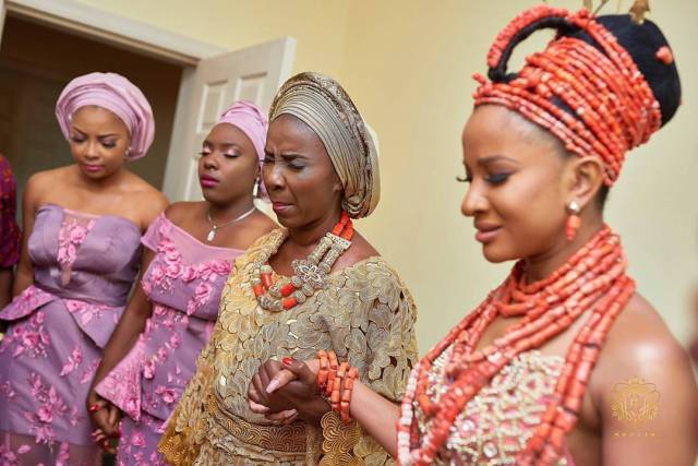 Adesua Etomi's Mom praying for her, before her traditional wedding.